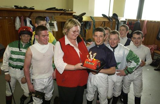 Rory being presented with a cake for his 18th birthday in 2005