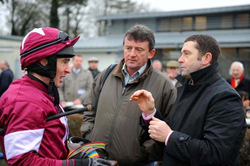 Eddie O'Leary (centre) is a part-owner of Storm who runs at Lingfield today