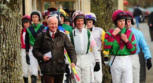 Winning jockey 'Puppy' Power (centre) follows clerk of the course Paddy Graffin out <br> for the opener at Gowran