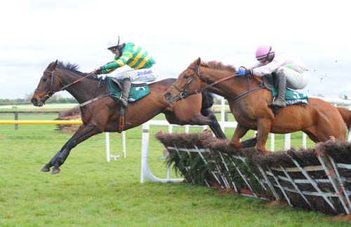 Alderwood leads over the last from Allure Of Illusion at Fairyhouse
