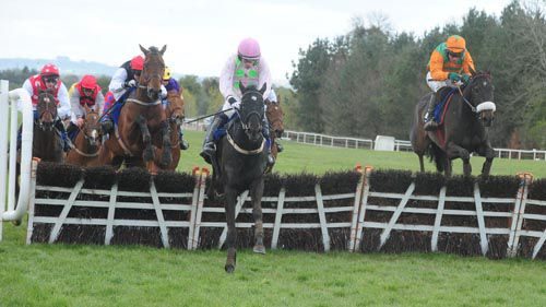 Mae's Choice and Paul Carberry (right) jump the last with Gorgeous Sixty (pink colors) leading