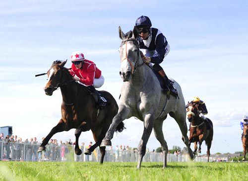 Grey horse Sky Lantern wins the featured Listed race at Naas under Richard Hughes