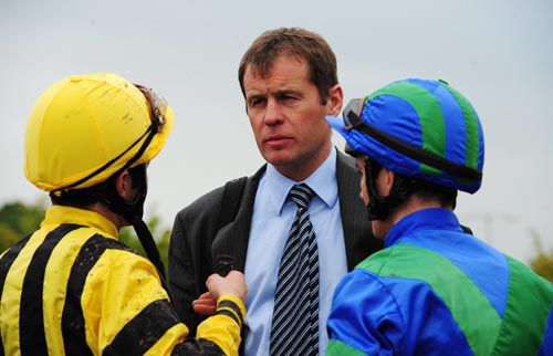 Colm O'Donoghue (left) & Gary Carroll (rider of the winner Punch Your Weight) with Andy Oliver after the race