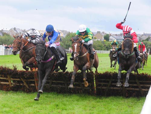 Lough Ferrib (blue) jumps to the front under Davy Russell from Princeton Plains (white cap) and Shamiran