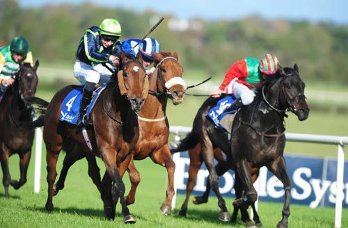 Snow Queen, left, moves into the lead at Naas