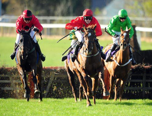 Top Madam (centre) is driven out on the run-in by Harley Dunne with Rising Time (left) and Miss Accurate (right)