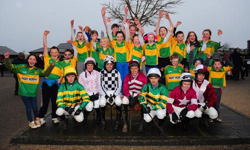 Children from the local Ballymore Eustace Football Club with jockeys at Punchestown