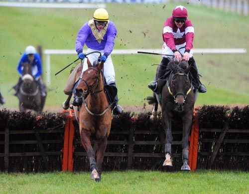 Urano & Paul Townend (left) jump the last just ahead of Ally Cascade and Davy Russell