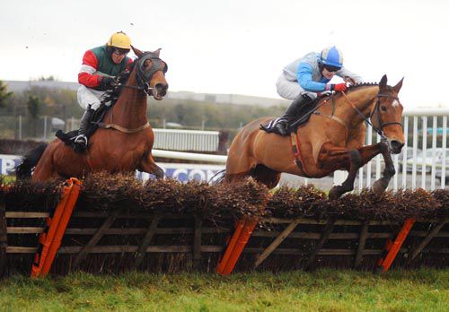 Rating Queen & Kevin Sexton (right) jumps the last ahead of High Class Show
