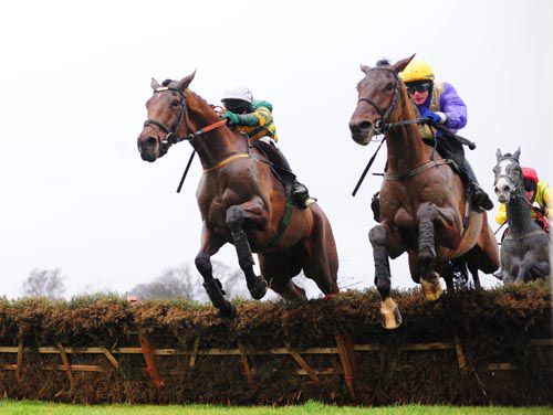 Ned Buntline (left) and Urano jump the last together with Grey Monk back in third