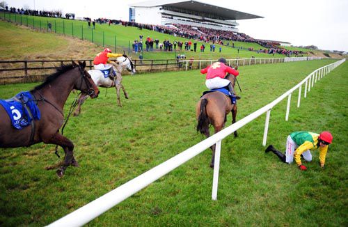 Carnage at the final fence as Jack Absolute (grey horse) leads