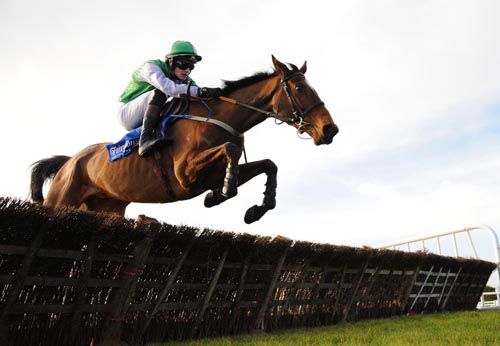 King Of Firth & Danny Mullins jump a hurdle on their way to victory