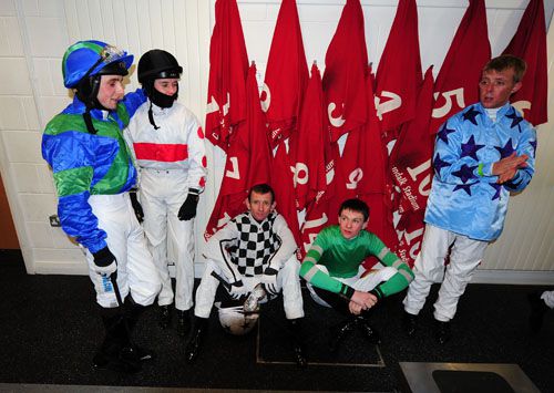 Jockeys wait in the weighroom as the first race is delayed
