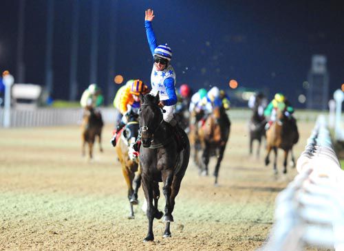Rory Cleary raises his arm in triumph after General Bunching won at Dundalk last year