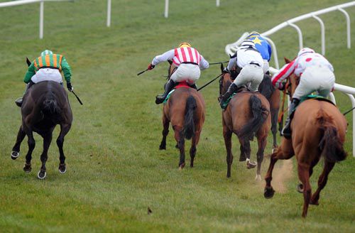 The principals race for home in Downpatrick's opener - winner Golden Firth (stripes)