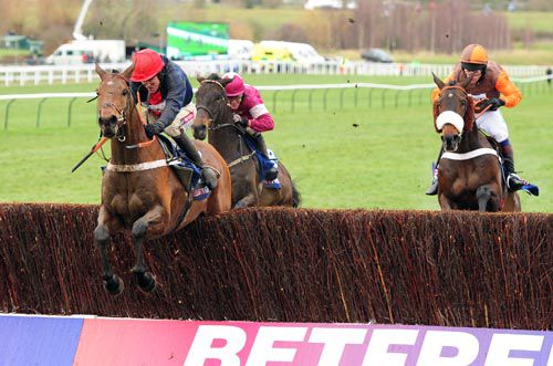 Bobs Worth jumps the last ahead of Long Run (right) and Sir Des Champs (left)