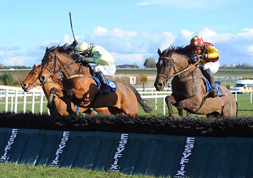 Whiskey And Rye (centre) leads over the last at Limerick