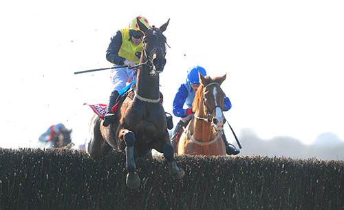 Kennoway jumps the last under Andrew Lynch from Steady Ed in second