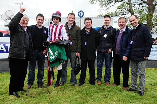 The Sticktothecows Syndicate, owners of Honey Bach, with winning jockey Declan Lavery