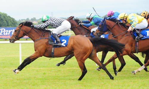 Legal Lyric swoops down the outside at Limerick