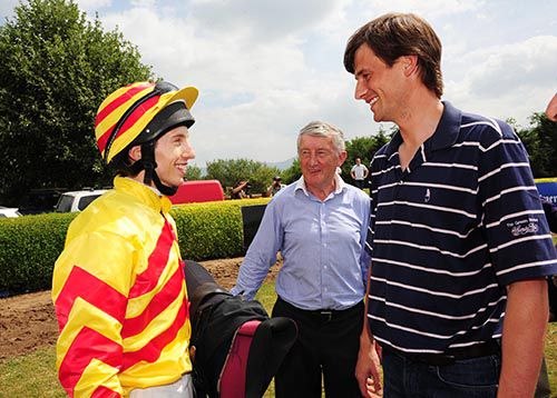 Jamie Piggott with trainer Tommy Stack  (centre) and Fozzy Stack