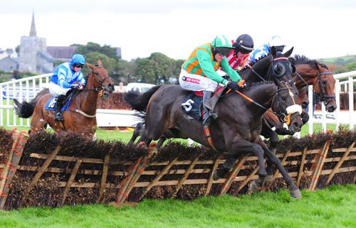 The Crafty Butcher jumps into the lead at the last in Listowel