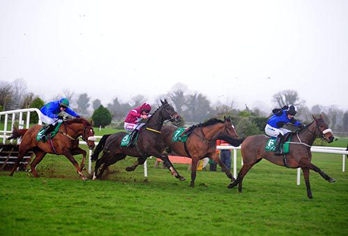 Jennies Jewel and Ian McCarthy race away from the last hurdle ahead of Ally Cascade and He'llberemembered