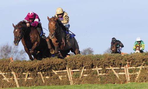 Sure Reef, right, comes to collar Akorakor at the last in Leopardstown