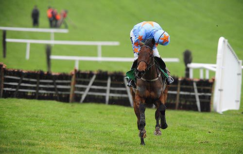 Ruby Walsh looks around for dangers as he canters home aboard Un De Sceaux 