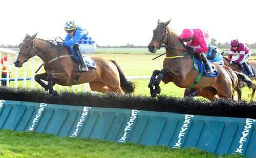 Pairofbrowneyes (left) and Adrian Heskin jump the last