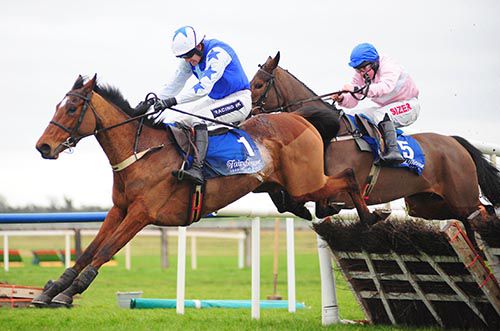 Beluckyagain (Ruby Walsh) jumps the last ahead of Ellie Mia (Andrew Lynch) in the 2nd at Fairyhouse