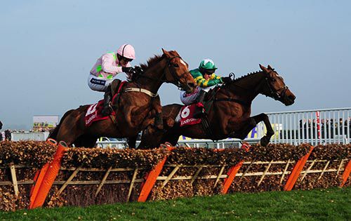 More Of That (right) and Annie Power jump the last in the Ladbrokes World Hurdle