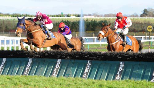 Gone Bust (Adrian Heskin) leads over the last from Mines River (right)