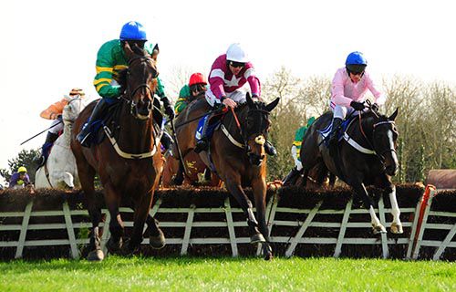 Cool Macavity (Barry Geraghty, right) jumps the last with City Slicker (blue cap) and The Game Changer (centre)