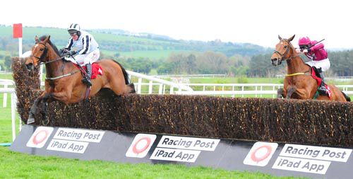 Operating (Robbie Power) clears the last in front of Road To Riches (Ger Fox)