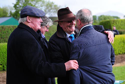 Dick O'Sullivan, manager of Punchestown, and Tom Cooper embrace after the success of Chute Hall