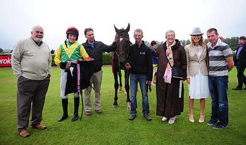 Fort George poses with his winning connections in Killarney