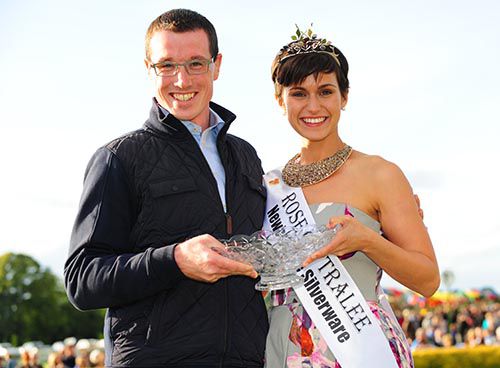 Kris Weld is presented with the winners prize by Maria Walsh who was crowned the Rose Of Tralee last night