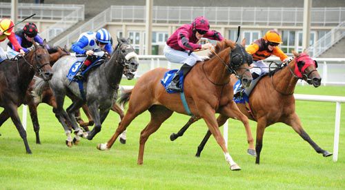 Tylery Wonder, red, on his way to victory in the Curragh