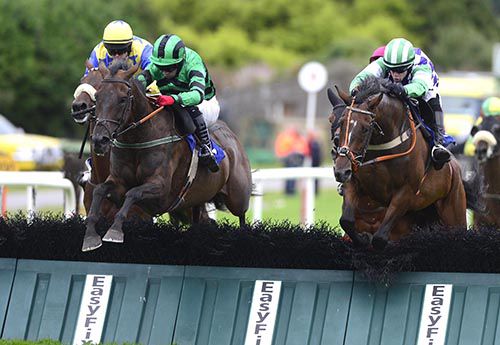 Old Theatre Royal (Robbie Moran, left) jumps the last with Roman Numeral (Martin Ferris)