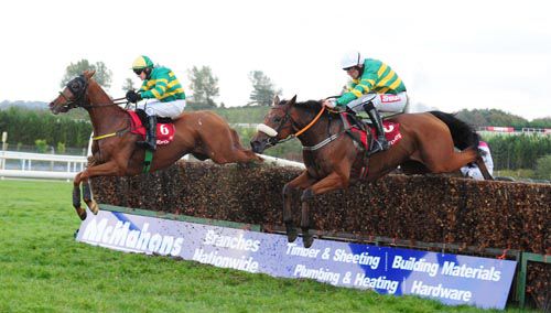 Tom Horn (left) and Shanpallas jump the last together in the Munster National at Limerick