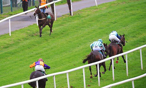 Crown Theatre leads Fearachain close home as a loose horse comes to meet the field