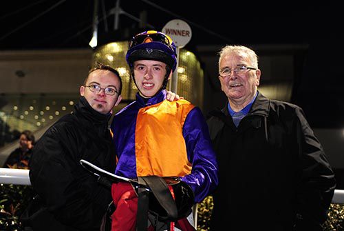 Jockey Dylan Robinson with Niall (left) and his father Eugene Kavanagh, owners of War Room