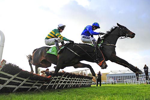 Hurricane Fly (right) and Jezki jump the last in the Morgiana Hurdle at Punchestown
