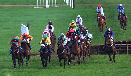 Stay With It (left) leads as Davy Russell is almost unseated from Leave At Dawn