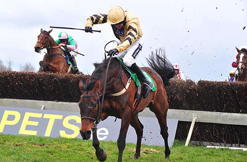 Felix Yonger and Ruby Walsh race away from the last 