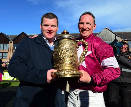 Gordon Elliott and Paul Carberry pictured after Don Cossack's Punchestown Gold Cup triumph