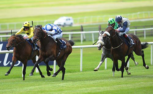 Al Kazeem, second left, comes through to win at the Curragh