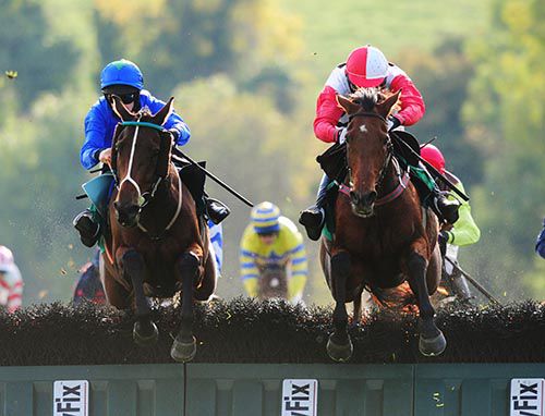 Most Honourable (left) and Urban Dusk jump the last together 