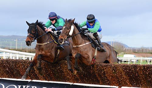Finea and Jack Kennedy (right) jump the last fence with Dr Moloney